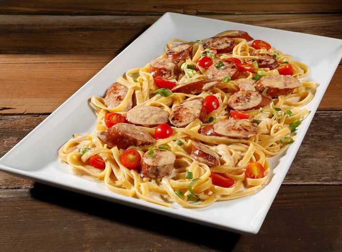 https://www.hillshirefarm.com/static/eda5f557f82d70fcfc4cebe815494f89/9a128/smoked-sausage-alfredo_1366x1005.jpg